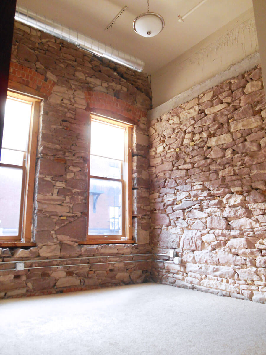 Exposed_Stone lofts on canal brick walls