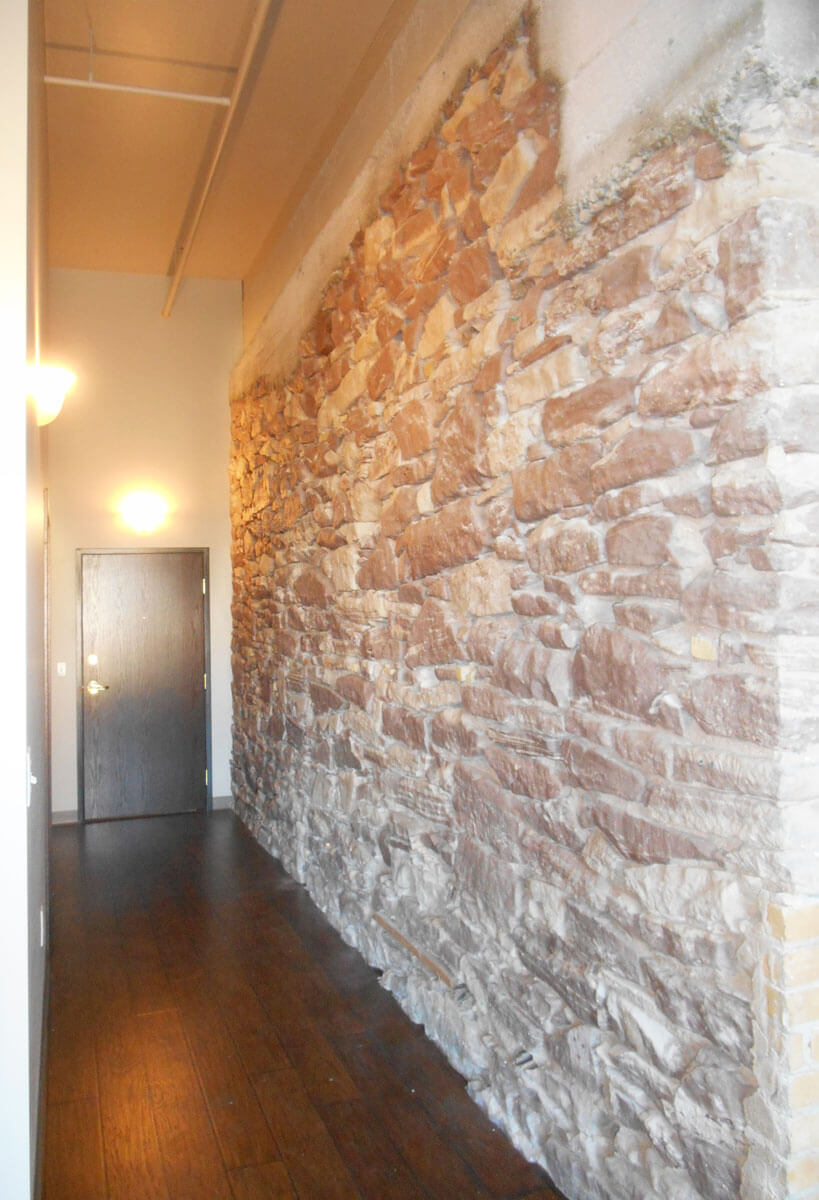 Hallway_exposed_stone lofts on canal hallway stone