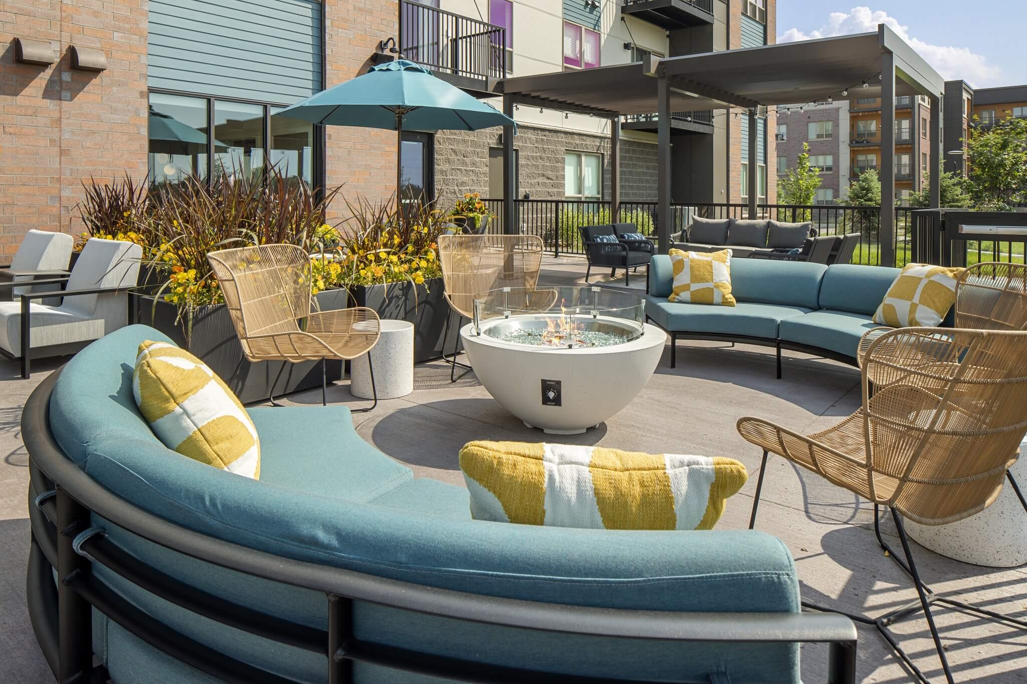 Aster at Riverdale Station outdoor amenity terrace with couches and umbrellas