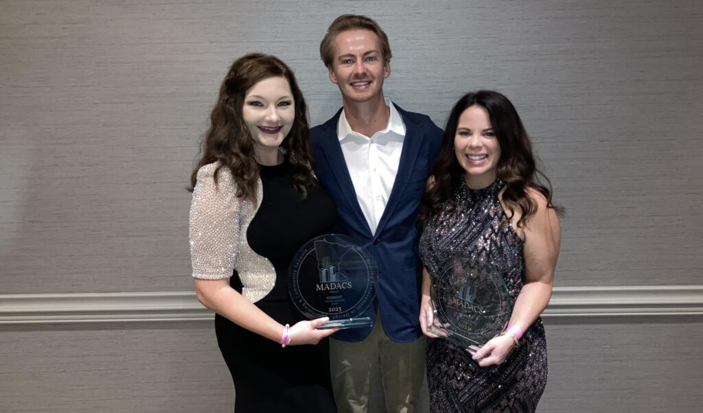 Brittany Lengling, Nic Ottoson, and Amanda Goins, winners of the MADACS Award for the Moment Website